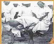 Gandhi- Enjoying himself and others while picking up salt from Dandi. from gantar dandi bangali