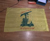 An original Hezbollah flag brought back from the Middle East from piece from the middle east scene