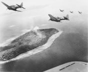 U.S. Navy Douglas SBD-5 Dauntless dive bombers of Bombing Squadron 16 (VB-16) over Japanese installations on Param Island, Truk Atoll, 17-18 February 1944 [21211671] from truk truk patrol