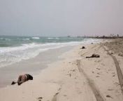 [50/50] Kids Playing On Beach [SFW] &#124; Bodies Scattered Across Beach [NSFW] from nudists on beach