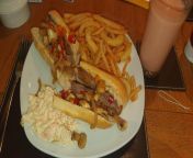 Steak, onion, peppers and mushroom baguette with fries onion rings and coleslaw from vk onion