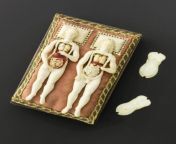 Ivory anatomical figures of a male and a pregnant female, with some internal organs removable, and engraved with muscles, very likely used to teach lay people about basic human anatomy; on wooden couch, possibly German, 1600-1700. Science Museum Group Col from sikadhi col
