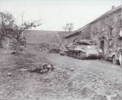 M-36 or M-10 Tank Destroyer in recently captured Gorpdorf with dead Nazi in foreground. Town was taken by the 5th Infantry Division of the U.S. Third Army. Dated 3/5/45. Signal Corps Photo. NARA #1107 from nara fakenude