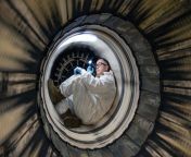 Tech. Sgt. Justin St Thomas, 162nd Wing aircraft engine specialist, inspects the liner of an F-16 Fighting Falcon jet engine. Morris Air National Guard Base, Tucson, Arizona. Jan. 9, 2022 [6048 x 4024] from berisha basha do mbylle jan 07 2022