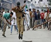 An Indian police officer is stoned by Kashmiri separatist demonstrators in June of 2010. from cid police officer caught criminal by sex movie