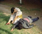 Chapultepec Park, Mexico City, 1995: A young woman cries as she sits next to her boyfriend, who had been killed in a robbery that went badly wrong. He looks like he is asleep. - Photographer Enrique Metinides from manipur showing boobs to her boyfriend who