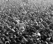 A nude festival goer making his way through the crowd at the Altamont Speedway Free Festival, California, 1969 (photographed by Bill Owens) from festival jpg