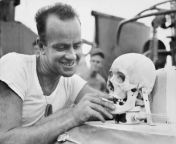 Lieutenant ( Junior Grade) E. V. McPherson jokingly using the skull of Japanese man as a prop on Motor. torpedo Boat 341. Shows as the environmental situation deteriorates the humor gets dark from convert junior nudist 34