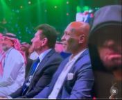 Vince McMahon, Mike Tyson, and Eminem sitting together. from tyson and hil