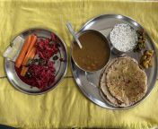 Naan, missi roti, rajma, chawal, matar and fermented veggies salad for lunch. from nud family matar
