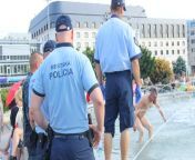 A naked drunk guy in a water fountain in Bratislava being arrested during antivaccination protests from xxx naked drunk girls