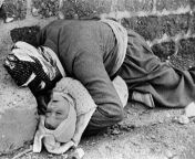 One of the most famous photographs of the 1988 Halaja chemical attack of Iraqi Kurdistan. Shown here is 54 year old Omer Khawar, clutching his son Muhammad in his arms as he died trying to flee the range of the chemicals. 5000 men, women, and children die from bangla dudh khawar golpo