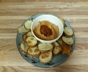 Oven baked potato slices with hummus and red shatta from shatta
