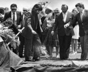 John Landis sprinkles dirt on the grave of Vic Morrow at Hillside Memorial Park in Culver City, California on July 26, 1982. Morrow was killed along with two child actors three days earlier during a helicopter stunt accident on the set of Landis&#39; segm from vic marrowind hooked