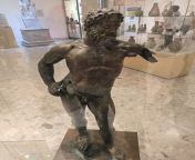 a bronze statue of Heracles, found in Baghdad, ruins of Seleucia, there are writing in Latin on the right leg and Aramaic on the left leg, both talking about the kingdom of Missan, dated to the Hellenistic period (312-139 BC), Housed in the Iraqi museum,from iraqi guy