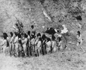 Historical post: Naked Jewish women, some of whom are holding children, await their turn to be executed by Nazis from naked crucified women