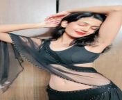 Aditi Phirke navel in black sleeveless blouse and skirt with transparent dupatta from blouse and bra of