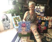 Me and some of my (in progress) paintings of women from ball grabbing women