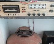 A picture of a poor area in Bangladesh in the mid-90s. It is known that this type of music system was very popular at that time. from panis in bangladesh