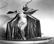 Actress Marian Martin in devil-themed burlesque cape, 1943 from made marian