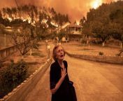 Happening nowRitsopi Panayiota, 81, reacts to the fire reaching her home in the village of Gouves in Greece from www xxx bid hindi bf village home in bha