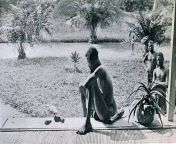 A father stares at the hand and foot of his five-year-old daughter severed as a punishment for him failing to make the daily rubber quota. Belgiums terrifying colonialism of Congo, Africa, 1904. from libolo congo