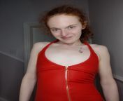 A redhead who is braless in a red dress from waitress in braless