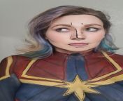 An attempt to body paint the comic book Captain Marvel from spiderman captain marvel