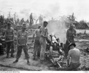 WWII. Borneo Campaign. Battle of Balikpapan. 1 July 1945. Australian gunners from 8 Battery, D Troop, 2/4th Field Regiment, fire an Ordnance QF 25-pounder Short at Japanese positions from Vassey Highway some 200 yards from Green Beach, during Operation Ob from 1utnmeobj2hchqxkkmbf qf yxp1ld6i 1203w