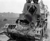 Burnt Soviet BT-7 light tank of 1938 model. In the open hatch can be seen the charred body of the tanker. from oasi the tanker