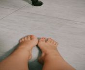 Dirty girl with dirty feet on a dirty floor from dirty pants on floor