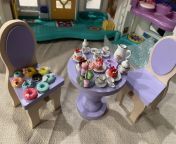 Just a little without a daddy playing with her new toy. A ceramic teaset for dolls with a metal macaroon stand, cakes, donuts. I already had table chairs. I only spilled the water in cups a little. Was it pretty from 40 mandy playing in her chair