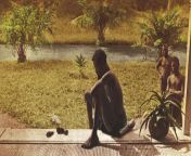 A man sits looking at a dismembered small foot and small hand. They belonged to his five-year-old daughter, who was later killed when her village did not produce sufficient rubber. Congo, ca. 1900. Photo: unknown from her brother did not agree
