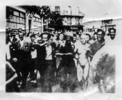 A French woman accused of being a German collaborator has her head shaved and paraded naked through the streets of Paris. August 1944. from karan gillan head shaved