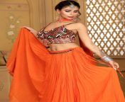 Annie Sharma navel in colorful choli and orange ghagra from hot song in backless choli