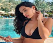 Nora or as well redditors call her lauda fatehi in her black bikini showing tonnes of cleavage and her sexy black mole from kerala antes xxxnxiraqi dancing in black bikini showing ass cheeks and