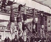 [220 x 156][NSFW]The corpses of Mussolini (second from the left), Petacci (middle), and other fascist leaders hanging upside down in Pizzale Loreto in Milan after being executed by firing squad. from darjeeling loreto conv