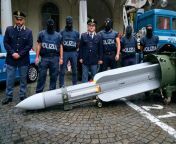 Italian police taking a picture with an air to air missile they seized from Neo-Nazi gang in 2019. from italian police movie