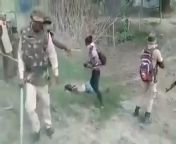 Illegal immigrants asked to move and then fired upon by the police in the state of Assam, India. Apparently the camera man is a professional photographer hired by the police from props to the camera man