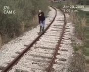 Man gets hit by a train while walking on train tracks. from chinese upskirts on train